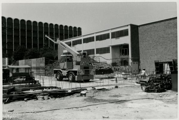View of Schoenberg Hall construction site with equipment in the center