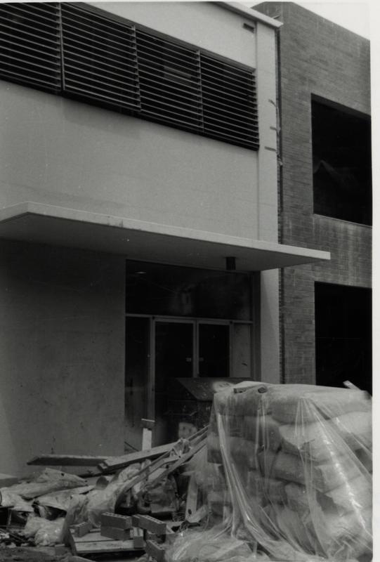 View of doorway with construction materials piled in the foreground