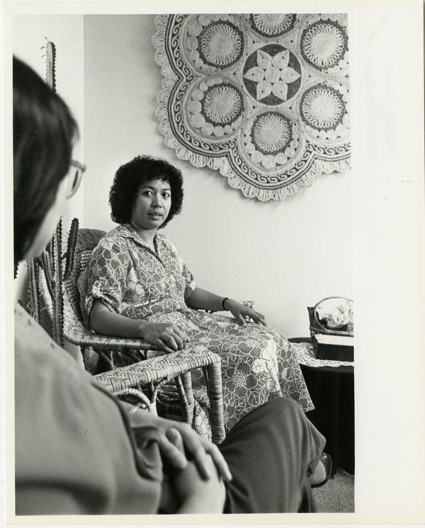 Elvira Quintos sits with client at the Asian Pacific Counseling Center, 1984 (5/10/1984)