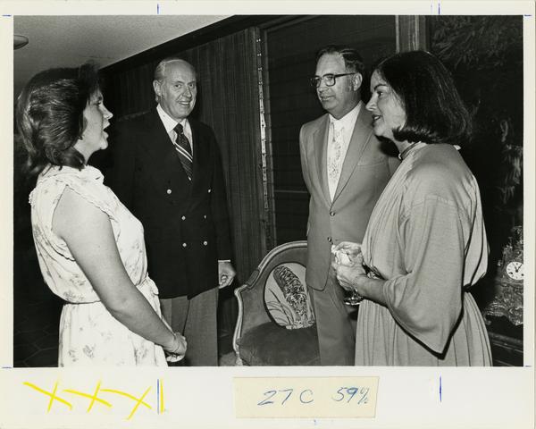 Harlan and Patti Amstutz greet Ralph Allison and unidentified woman at School of Medicine reunion