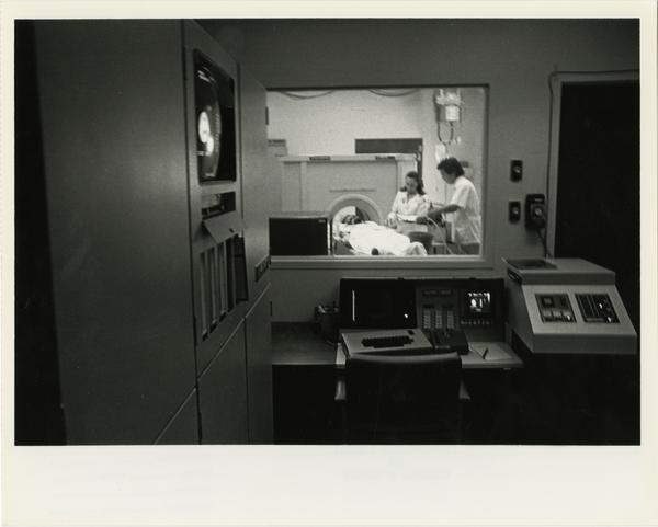 View of doctors setting up patient for the Computerized Tomography Simulater