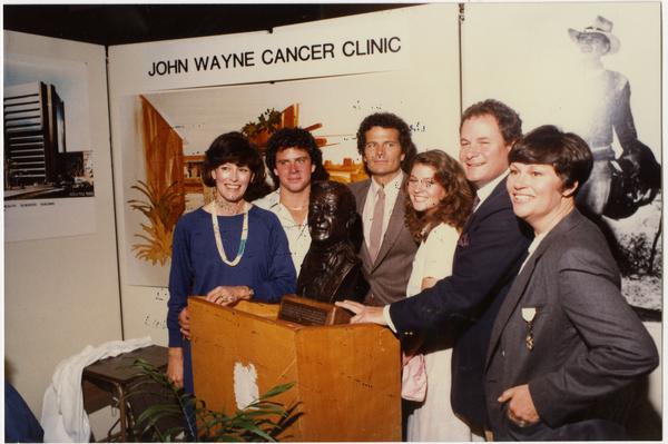 Michael, Patrick and Marisa Wayne pose with other family members at opening of John Wayne Cancer Clinic