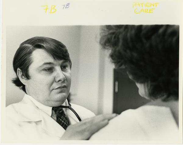Doctor examines patient