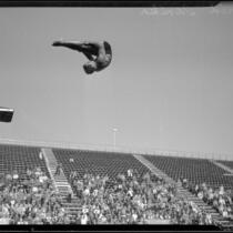 Farid Simaika, 1928 Olympic diver, in a pike position during the flight of a dive, between 1928-1929