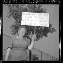 Woman holding placard stating "Keep Healeys Off Our Campuses..." in protest over Dorothy Healey's Cal State appearance, 1964