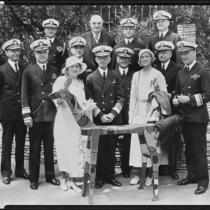 Peggy Hamilton, Clara Schofield, Burr McIntosh and ten Navy admirals at the Breakfast Club, Los Angeles, 1932