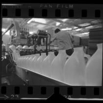 Plastic milk bottles on the production line at Western Preformed Container Co., Covina, Calif., 1968