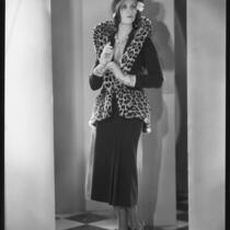 Peggy Hamilton modeling a suit of brown velvet velour trimmed with baby leopard, 1930