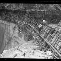 Workers walking on the face of Santa Anita Dam during construction, Calif., circa 1926