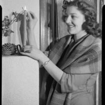 Betty Hanna lighting candle, 1941