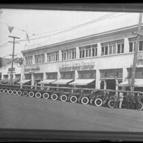New Los Angeles police cars lined up in front of Albertson Motor Company building, circa 1925