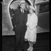 Henry Bern and Irene Harrison outside airplane, 1932