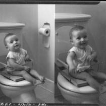 Eight-month-old Rosita Dee Cornell sitting on the toilet in a potty training chair, California, 1931