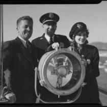 Actress Boots Mallory operating a ship's signal lamp, Santa Monica, 1937