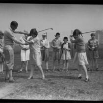 Girls with their golf instructor at the Wilshire Country Club, Los Angeles, 1927