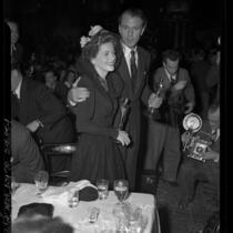 Actors Gary Cooper and Joan Fontaine holding their Oscars at Academy Awards after party, 1942