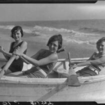 Young women posing in rowboat on beach, Pacific Palisades, 1927