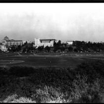 Distant view of baseball game with campus in background, 1946