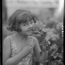 June Starr Carroll with rose, 1925