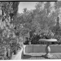 Wright Saltus Ludington residence, view of wisteria lined terrace with round pedestal table, Montecito, 1931
