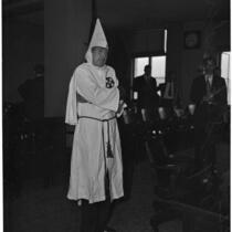Former Ku Klux Klan Kleagle, Ray J. Schneider, in Klan robes at trial, Los Angeles, 1946