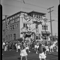 Marching band passing Elks Club building in Elks' parade, Santa Monica, 1939 or 1952