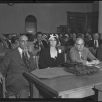 Photograph of Myrtle St. Pierre seated with Lorrin Andrews and another attorney at the County Courthouse, Los Angeles, 1932