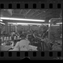 Garment workers in sweatshop, Los Angeles, Calif., circa 1971