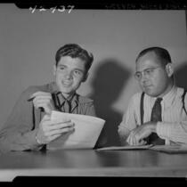 World War II veteran Audie Murphy with unidentified man during screen test in Los Angeles, Calif., 1946