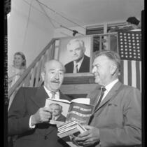 Actor Adolph Menjou looks over a copy of  "The Conscience of a Republican [Conservative]," with Paul H. Talbert, 1960