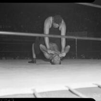 Jules Strongbow and Nick Lutze wrestle to a draw at the Olympic Coliseum.  July 7, 1937.