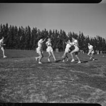 Female U.C.L.A. students playing soccer in a field, Los Angeles