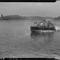 Young people in motorboat "Graceful" on lake, Lake Arrowhead, 1929