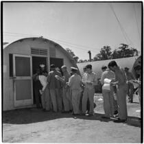 Veterans lined up to purchase Quonset huts and other surplus military supplies, Port Hueneme, July 15, 1946