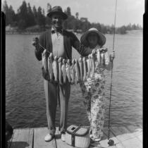 Actors Rod La Rocque and Vilma Banky with fish, Lake Arrowhead, 1929