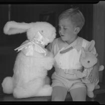 Boy with toy bunnies, Los Angeles, circa 1935