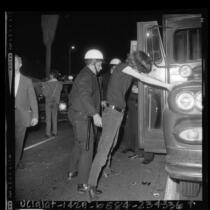 Youth being searched by police during crackdown on the Sunset Strip, Los Angeles, Calif., 1966