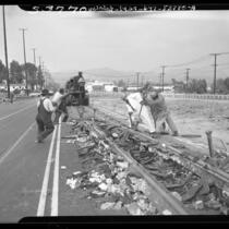 Wrecking crew tearing out streetcar tracks on Vermont Ave. in Los Angeles, Calif., 1948