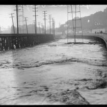 Glendale bridge destroyed by a storm flooding in the Los Angeles River, Los Angeles, 1927