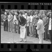 Kareem Abdul-Jabbar presenting No. 1 Laker jersey to President Ronald Reagan, 1985