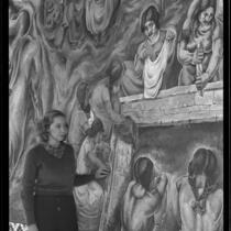 A young woman looking at the "Pastoral California" fresco by Charles Kassler at Fullerton Union High School, Fullerton, 1934