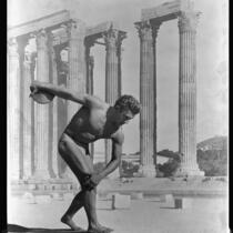 Montage photo of discus thrower, in the pose of the Greek Discobolus sculpture, superimposed on Olympieion (Temple of Zeus), 1932