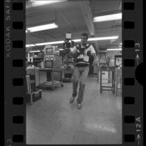 Engineer and developer John Jurgens demonstrating Steadicam camera in Los Angeles, Calif., 1978