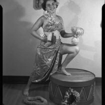 Young woman posing in Polynesian-style costume, 1951