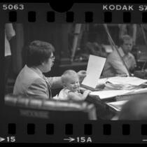 Councilman Zev Yaroslavsky holding his infant daughter Mina during meeting in Los Angeles, Calif., 1978