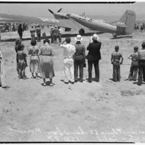 Crowd gathers to catch a glimpse of the airplane that set a world record, flying non-stop from Moscow to southern California.  July 14, 1937.