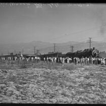 Distant view of bystanders looking on railroad accident, Glendale, 1935