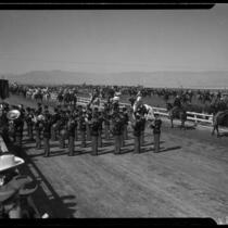 Band performing at Desert Circus Rodeo on parade grounds at Palm Springs Field Club, Palm Springs, 1938