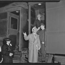 Actor Leo Carrillo, writer Frank Condon, and Los Angeles Chamber of Commerce president Robert L. McCourt boarding a train for Mexico, 1936