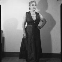 Woman in print dress, [1950s?]